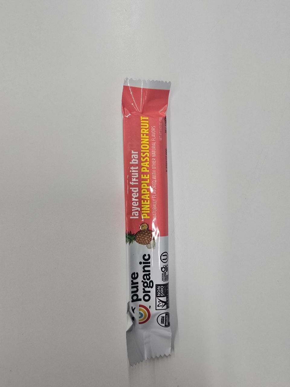 Pure organic fruit bar pineapple, passion fruit